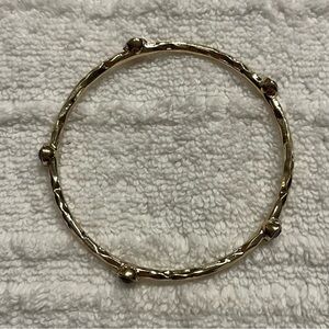 Gold tone bangle bracelet. Purple accents. Layer!  Simple.